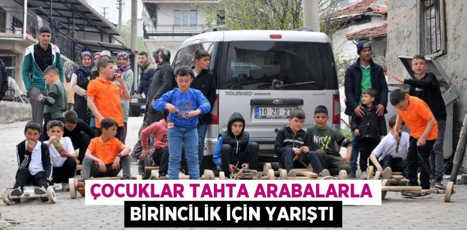 Çocuklar tahta arabalarla birincilik için yarıştı