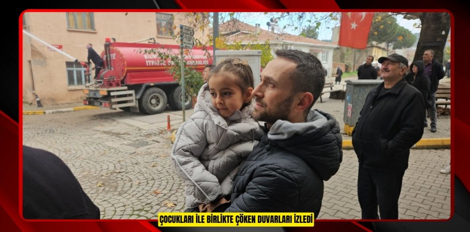 Çocukları ile birlikte çöken duvarları izledi